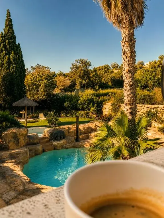 The Red Farm Relais and Spa gardens and pool view
